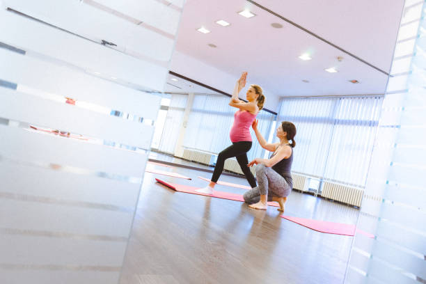 istock Pregnant women on a yoga class 641398228