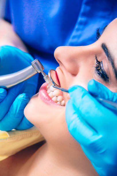istock Dentist examining a patient's teeth in the dentist. 641398298