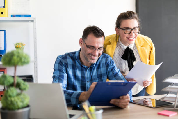 istock Young couple in the office 641399262
