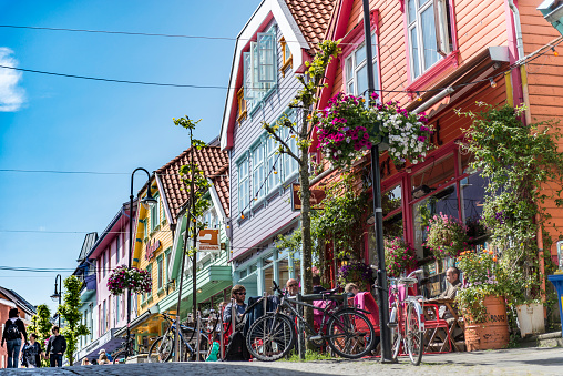 View of the old town streets, people and restaurants in Stavanger, Norway. Stavanger is one of most famous cruise travel destinations in Europe.