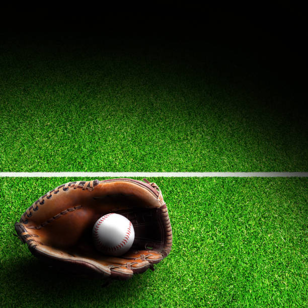 istock Baseball Glove and Ball on Field With Copy Space 641403298