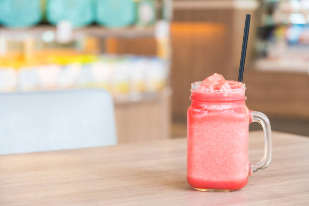 istock Watermelon juice in glass on wooden table 641404436