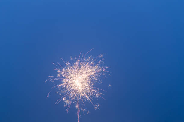 istock fireworks in the blue sky with long trail 641406424