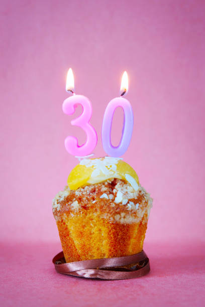 istock Muffin with burning birthday candles as number thirty 641407106
