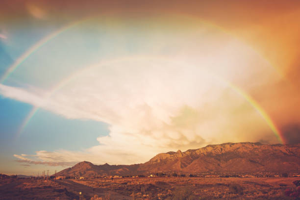 Double rainbow after a storm, with Sandia mountains in background stock photo