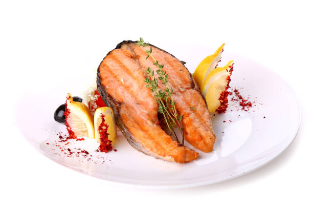 istock Fried salmon fish with a lemon and olives 641410466