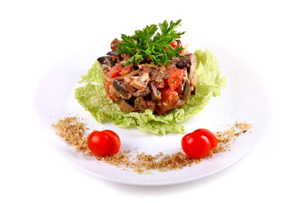 Salad of mushrooms and tomatoes isolated over white background