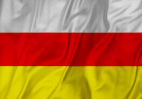 Closeup of Ruffled South Ossetia Flag, South Ossetia Flag Blowing in Wind
