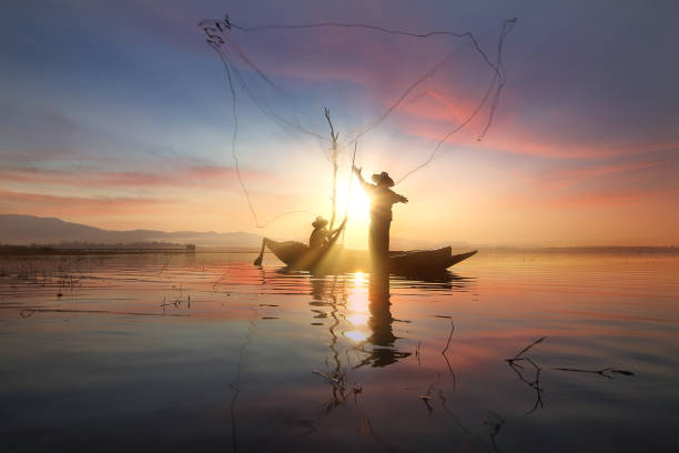 istock Silhouette of fishermen 641414228