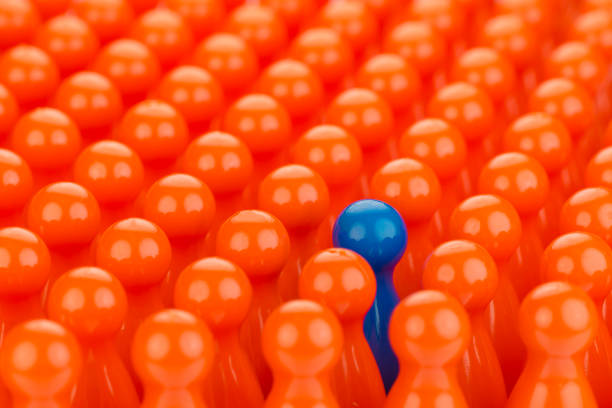 istock Conceptual orange game pawns and a blue play pawn 641415376