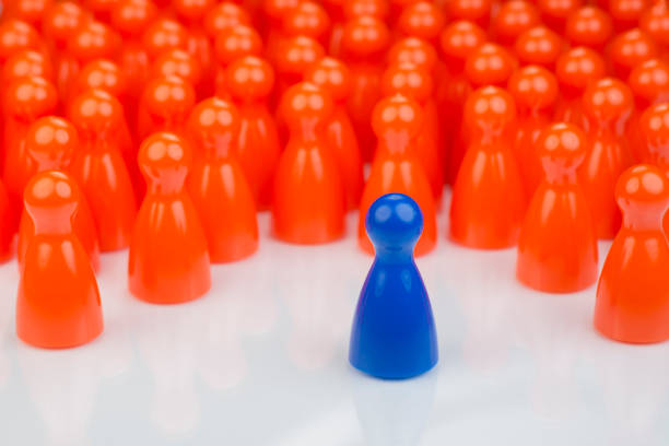 istock Conceptual orange game pawns and a blue play pawn 641415398