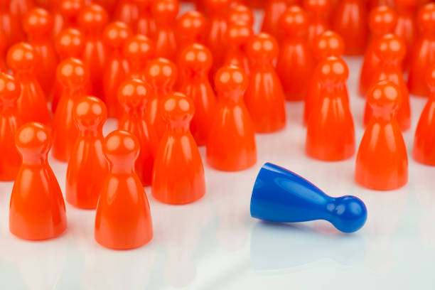 istock Conceptual orange game pawns and a blue play pawn 641415410
