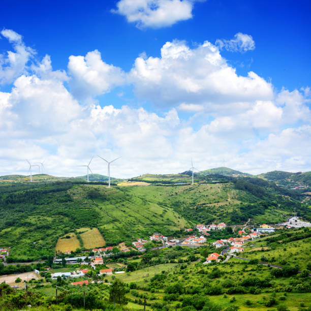 Wind turbine generator on top of hills in Portugal. Composite photo