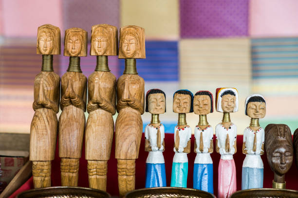 Wooden dolls the souvenir of karen long neck village Wooden dolls craft the souvenir of karen long neck village, the symbolic of long neck tribal women at the north of Thailand padaung tribe stock pictures, royalty-free photos & images