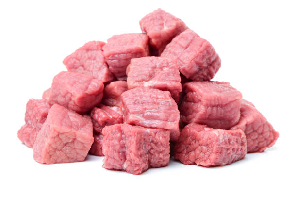 istock Small pieces  red meat chunk isolated over white background 641423248