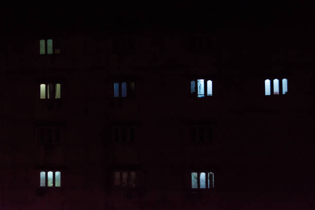 istock Dim lights from apartment windows at night in Yangon 1 641424130