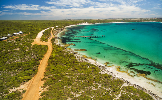Aerial view of Vivonne Bay pier and vivid turquoise ocean water, Kangaroo Island, South Australia