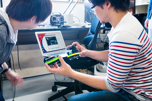 Student engineers working on tech for self driving automobiles. Kyoto, Japan. May 2016