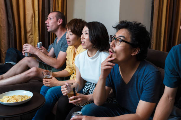 istock Group of friends watching a sports game 641428882