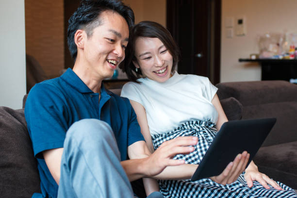 istock Couple looking at a digital tablet together 641428910