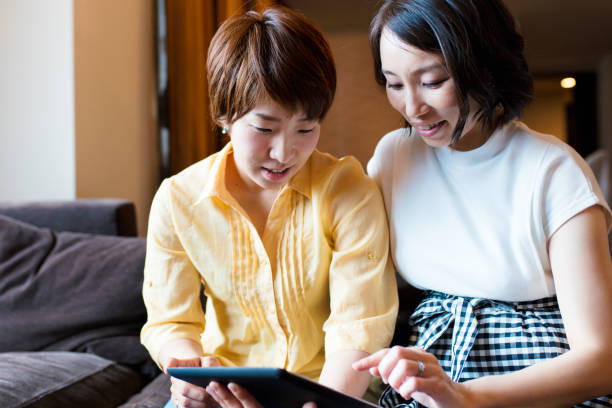 istock Friends looking at a digital tablet 641428928