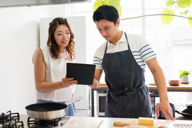 istock Young couple cooking together 641429510