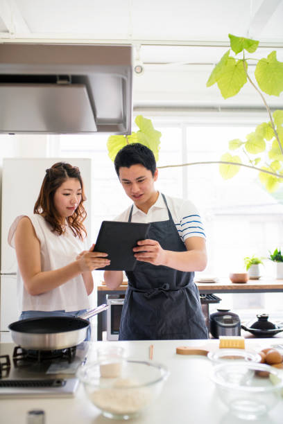 istock Young couple cooking together 641429532