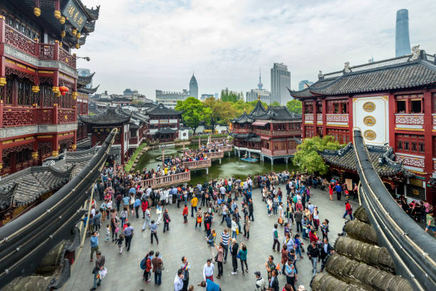People at Yuyuan Market in Old City of Shanghai, China. The market grew up around Yuyuan Gardens and City God Temple in 19th century during the Qing Dynasty.\