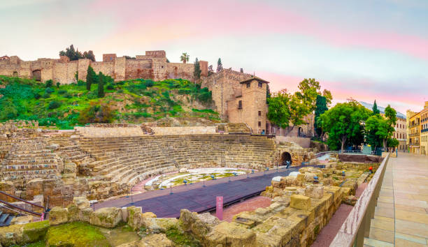 The Roman Theater of Malaga The Alcazaba of Malaga was build in the XI century and is a Moorish fortification with a roman theater adjacent to its walls. alcazaba of málaga stock pictures, royalty-free photos & images