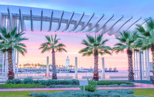 The Marine of Malaga The marine of Malaga, Spain. It is a modern region of the city with museums, restaurants, entertainment, and a ancient lighthouse at the tip. seville port stock pictures, royalty-free photos & images