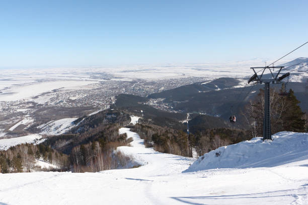 The ski slope on mountain The ski slope on Tserkovka mountain in the city the resort of Belokurikha, Altai, Russia foothills parkway photos stock pictures, royalty-free photos & images