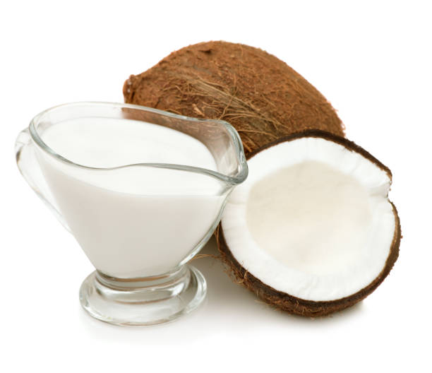 Coconut cream, milk Coconut cream, milk, coconuts isolated on a white background closeup coconut milk stock pictures, royalty-free photos & images