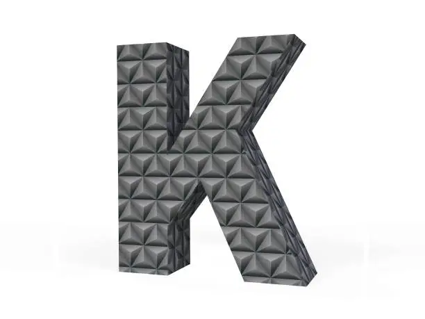3D Black Metallic Letter K With Diamond-cut Pattern Isolated on White Background