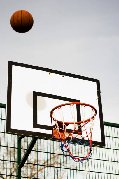 istock Basketball hoop in a school play area 641440124