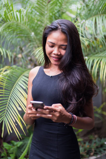 istock Young business girl using a smartphone 641441058