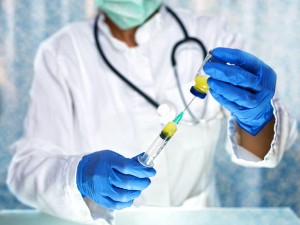 istock Female doctor preparing syringe 641441838