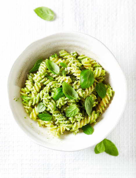 istock Pasta with basil pesto and fresh basil leaves 641443486