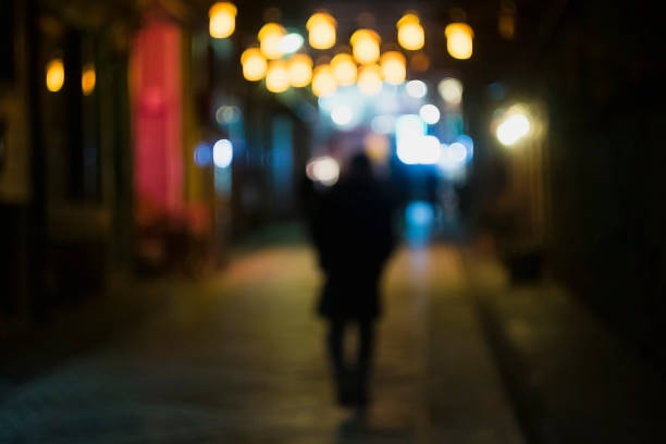 istock Lonely Man is Walking In Shiny Street 641444168
