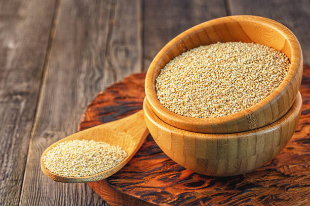 istock White quinoa in a wooden bowl 641444430