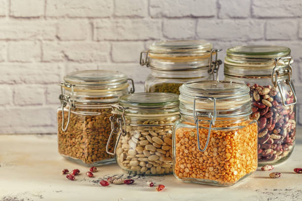 istock Glass jars with various legumes - beans, mung bean, peas and len 641444492