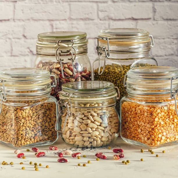istock Glass jars with various legumes - beans, mung bean, peas and len 641444542