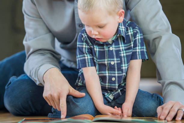 istock Looking at a Picture Book Together 641446354