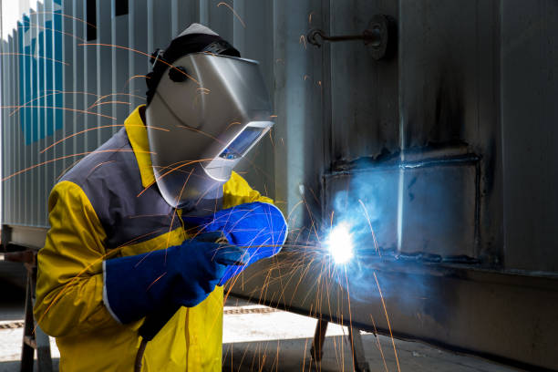 istock Industry worker with welding steel to repair container 641448334