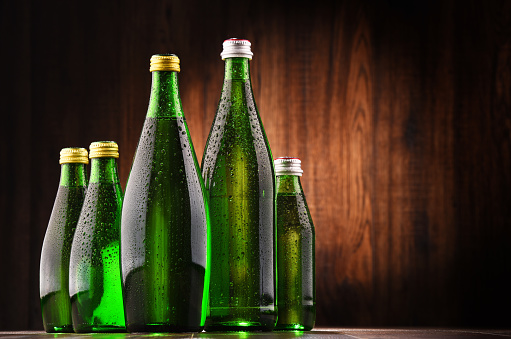 Composition with glass bottles of mineral water.