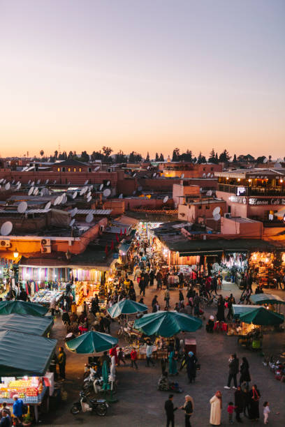 Marrakech -  Djemaa El Fna Square Dusk at Djemaa El Fna Square, Marrakech, Morocco djemma el fna square stock pictures, royalty-free photos & images