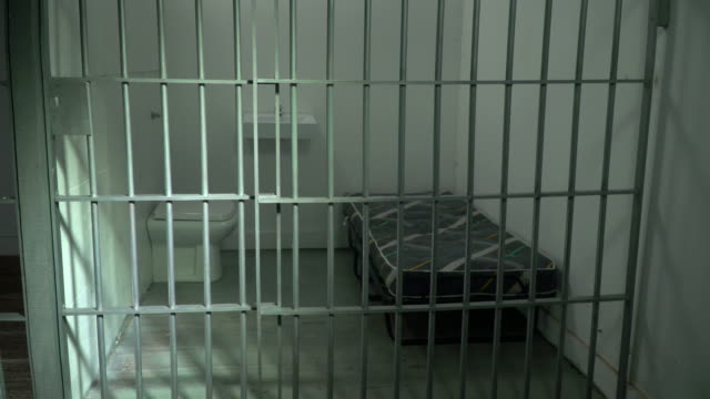 4K DOLLY: Empty Prison / Jail Cell with Steel Bars