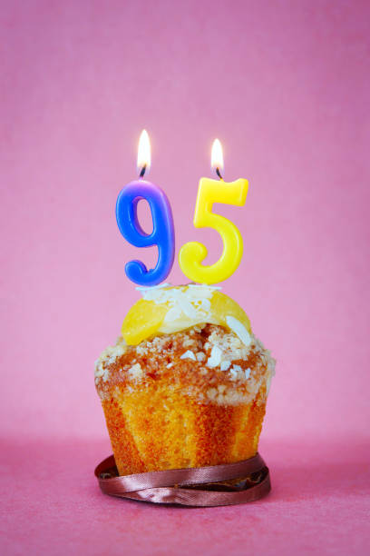 istock Muffin with burning birthday candles as number ninety five 641454530