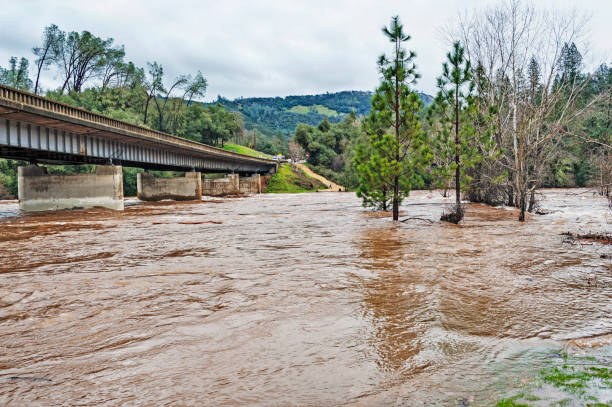 istock State Highway and Bridge over flooding river Lotus California 641455982