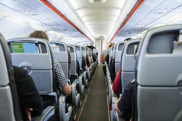 istock airplane with passengers on seats waiting to take off 641456126