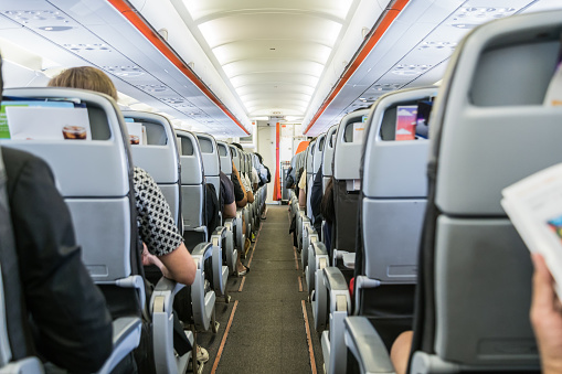 airplane with passengers on seats waiting to take offairplane with passengers on seats waiting to take off